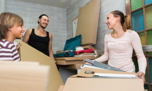 Removal team planning a move in Chessington with boxes and furniture