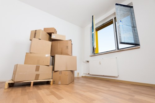 Moving van and packed boxes for a Chessington home removal