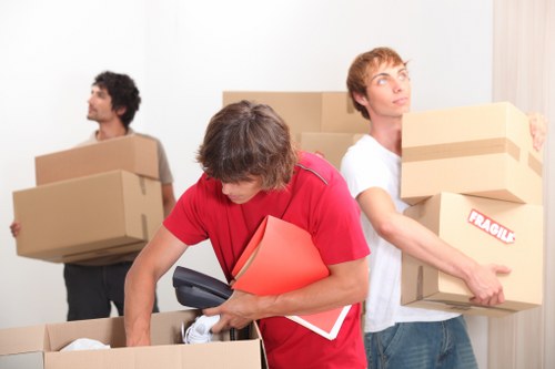 Careful loading of household items by local movers in Chessington