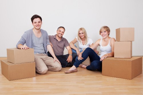 Local moving team handling furniture for a Chessington house move